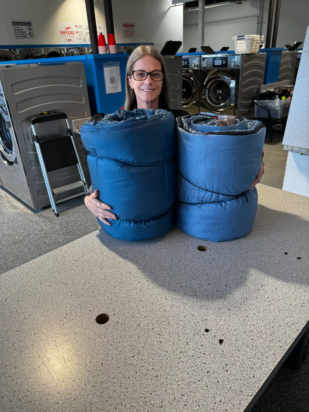 Freshly cleaned sleeping bags ready for pickup at Sandy Creek Laundromat, Colorado Springs CO 80916