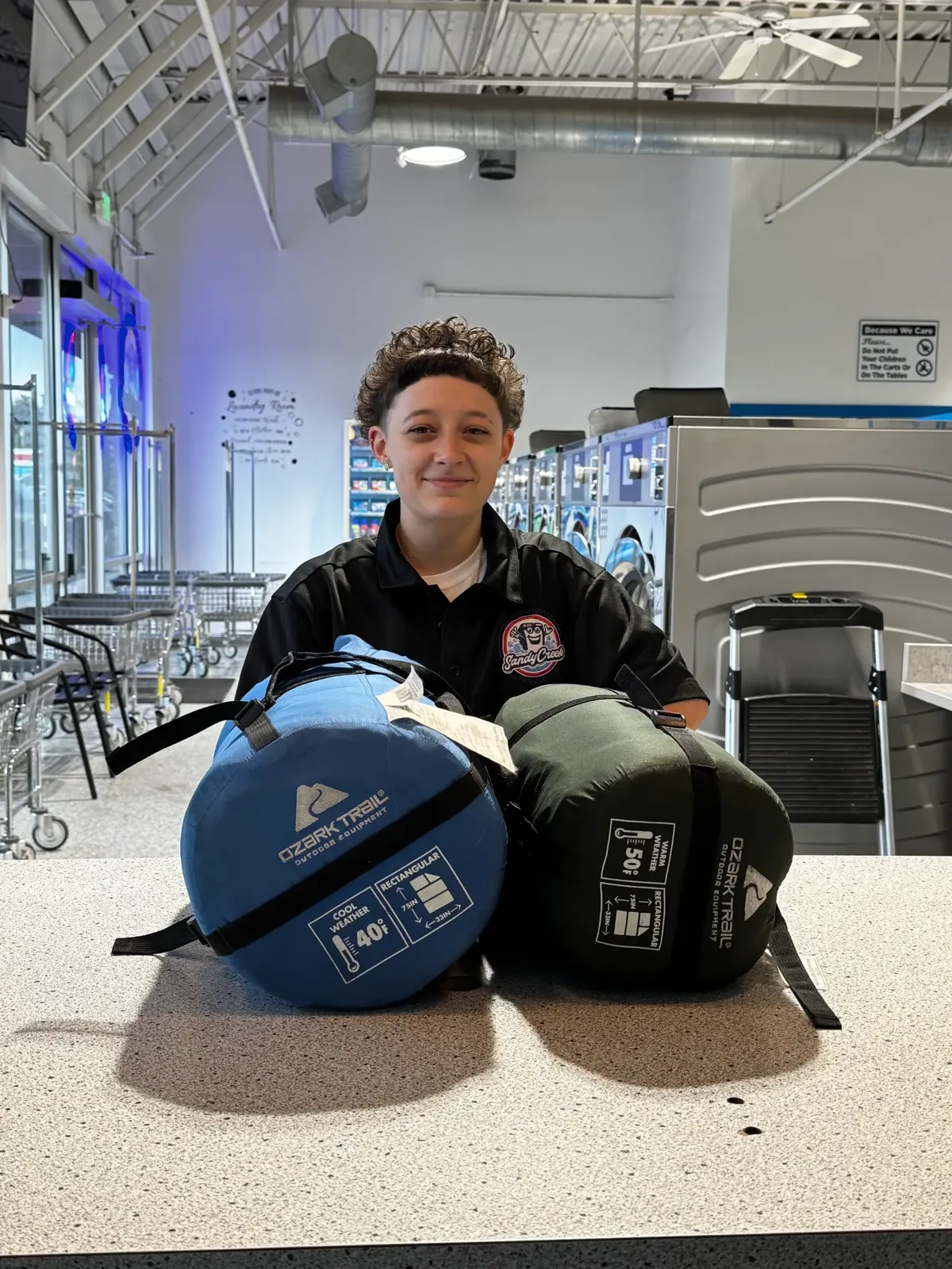Sleeping bag drop-off counter at Sandy Creek Laundromat — professional sleeping bag cleaning Colorado Springs